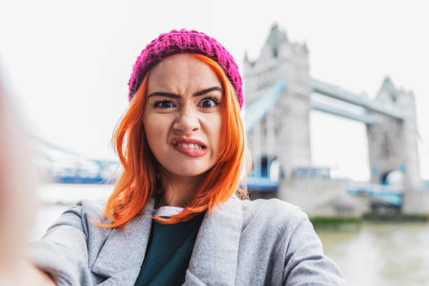 making funny faces for a selfie - tower bridge fotos imagens e fotografias de stock
