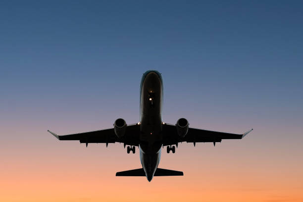 istock airplane on sunset sky , aircraft silhouette scenic sky 851868800