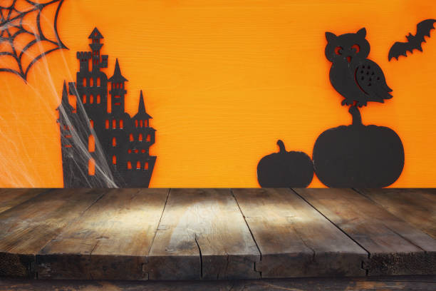 istock Halloween holiday concept with empty rustic table over orange background. Ready for product display montage 851870890