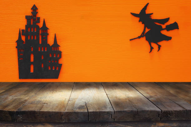 istock Halloween holiday concept with empty rustic table over orange background. Ready for product display montage 851870918