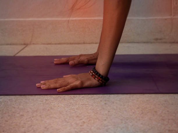 istock Hands posing yoga pattern on purple matt,vintage and art tone,blurry light background. 851871144