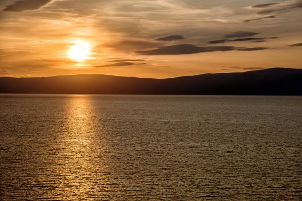 istock Beautiful sunset above the sea and mountain 851871852
