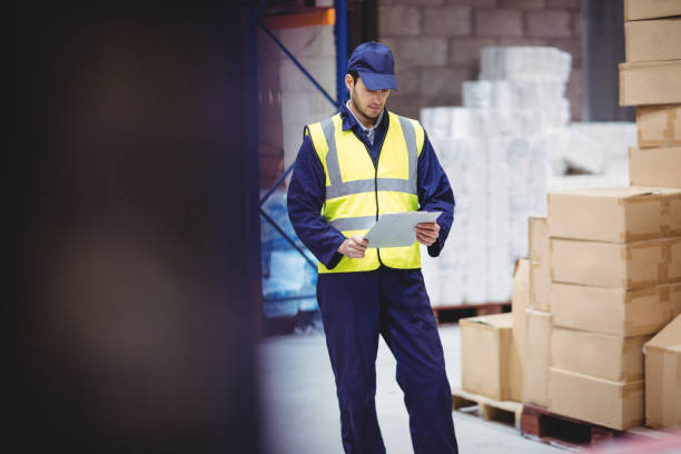 istock Portrait of warehouse worker with clipboard 851872506