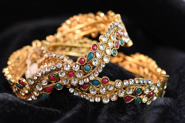 istock Fancy gold looking imitation bangles / bracelets on the woman's wrist 851872648