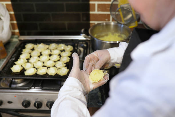 istock Male chef uses ingredients for preparing flour products on kitch 851878044