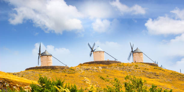 istock famous windmills in consuegra Spain bright summer sunny day / windmills in consuegra Spain. 851879716