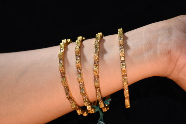 istock Fancy gold looking imitation bangles / bracelets on the woman's wrist 851885232
