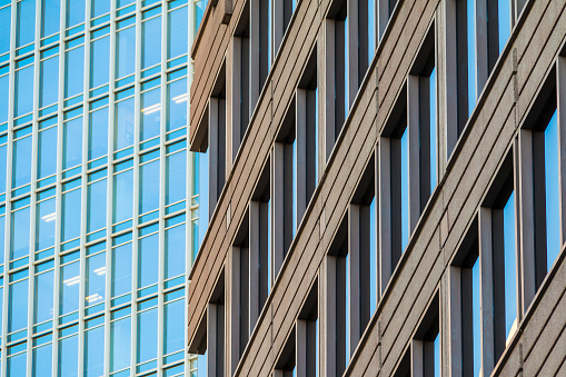 Composition of facades of two different office skyscrapers closeup, Atlanta, USA