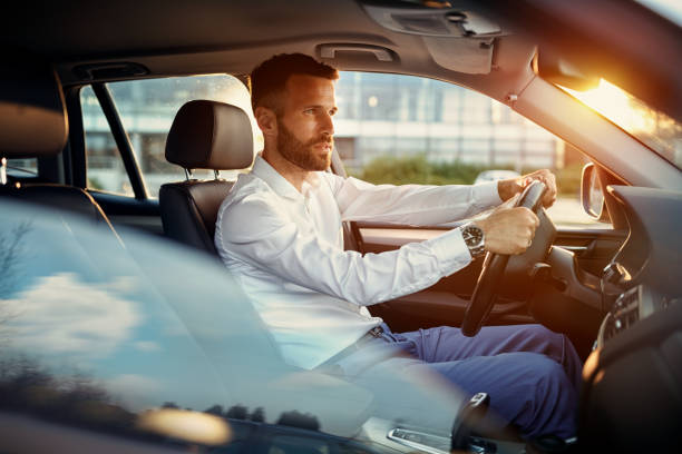 istock Young businessman driving car 851887508