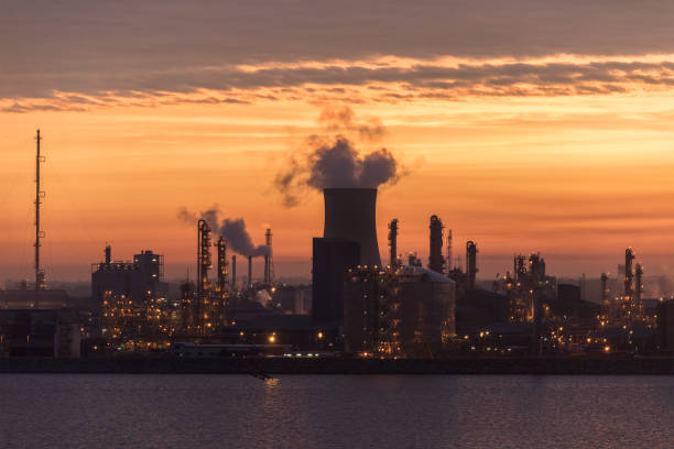 istock Dawn over an industrial skyline 851887714