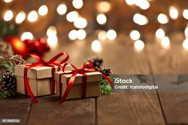 Christmas Gift Boxes On Rustic Wooden Table Stock Photo - Download Image Now - Christmas Present, Christmas, Gift