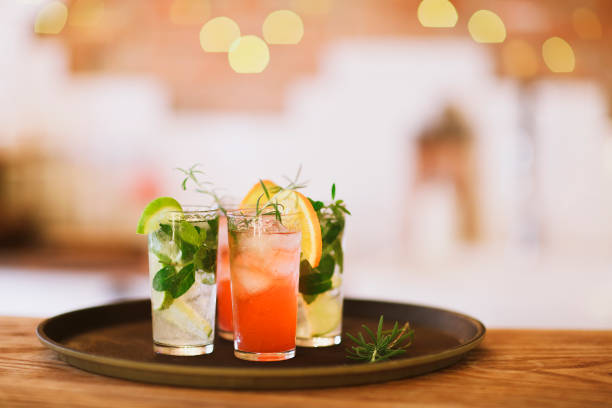 istock Two cocktail glasses on tray in the bar 851892300