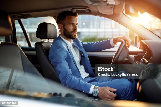 Attractive Man In Business Suit Driving Car Stock Photo - Download Image Now - Car, Driving, Men
