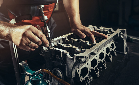 Repairing V10 engine in auto repair shop