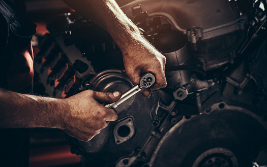 Repairing V10 engine in auto repair shop