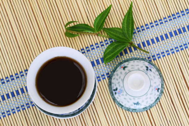 istock Strong tea in oriental cup on bamboo mat 851895312