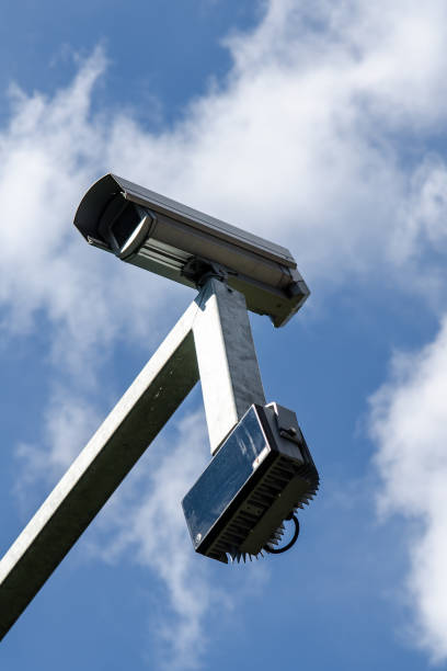 istock surveillance monitoring security camera with blue sky 851896448