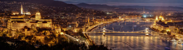 Night panorama of Budapest city - capital of Hungary. View from Gellert Hill. Hungary, Europe. Night panorama of Budapest city - capital of Hungary. Parliament building on right, Buda castle hill on left and Chain bridge in middle. View from Gellert Hill. Hungary, Europe. budapest danube river cruise hungary stock pictures, royalty-free photos & images