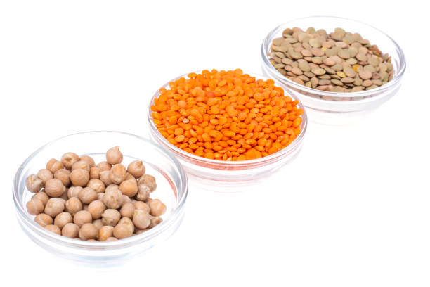 istock Chickpeas, orange lentils in and green, isolated on white 851898626