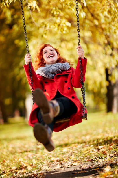 istock Cheerful girl swinging on swing 851899928