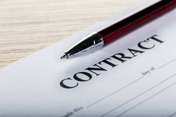 istock Pen and contract papers on wooden desk 851900786