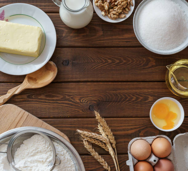 istock Ingredients for cooking on wooden background. Food background with copyspace. 851903830