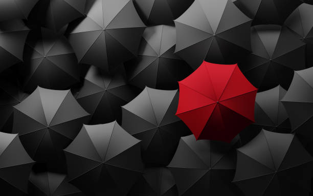 istock Red Umbrella Standing Out From The Crowd 851907476
