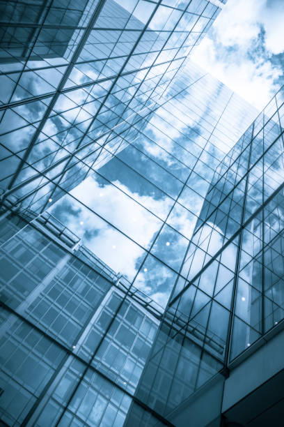 istock view of a contemporary glass skyscraper reflecting the blue sky 851907480