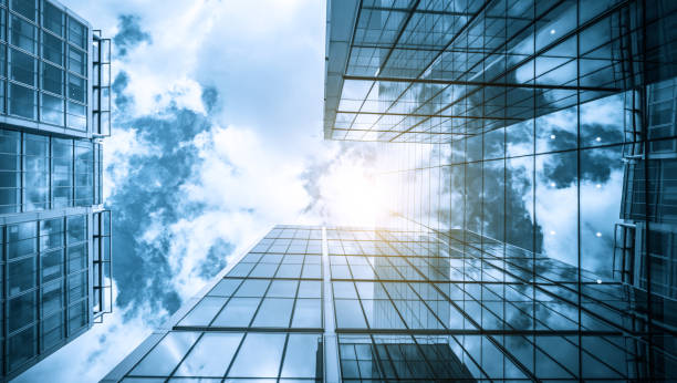 istock view of a contemporary glass skyscraper reflecting the blue sky 851907540