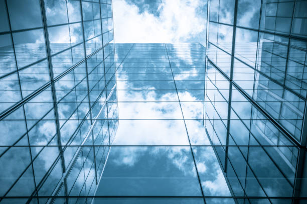 istock view of a contemporary glass skyscraper reflecting the blue sky 851907614