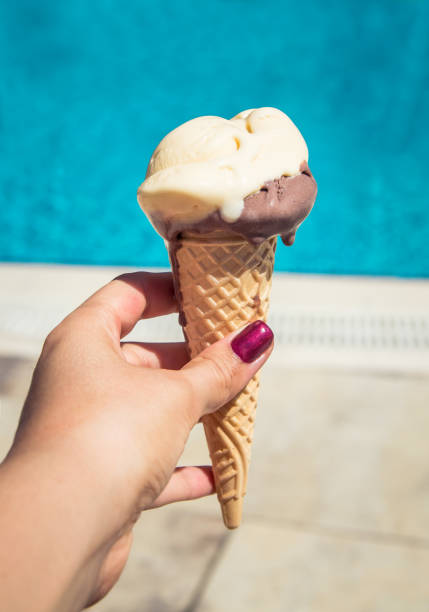 istock Ice-cream on swimming pool background 851907638