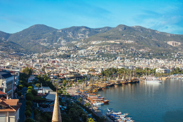 istock Young man looks at the Alanya port 851907766