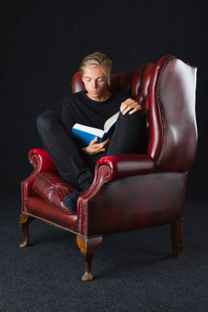 istock Fair-haired man in his 30s reading a book 851907864