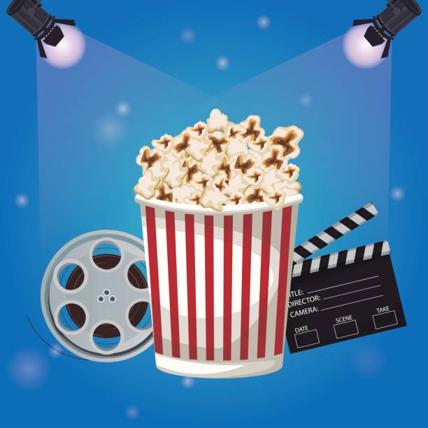 istock color background spotlights with popcorn clapperboard and film reel 851909422