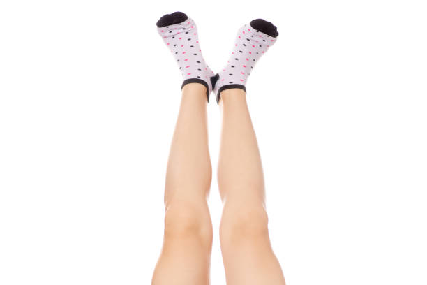 istock Female feet in socks warm 851912480
