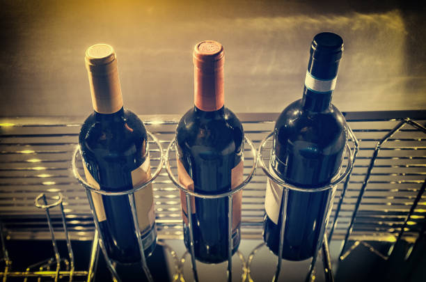 bottles of luxurious red wine hanging up in the bar, retro style