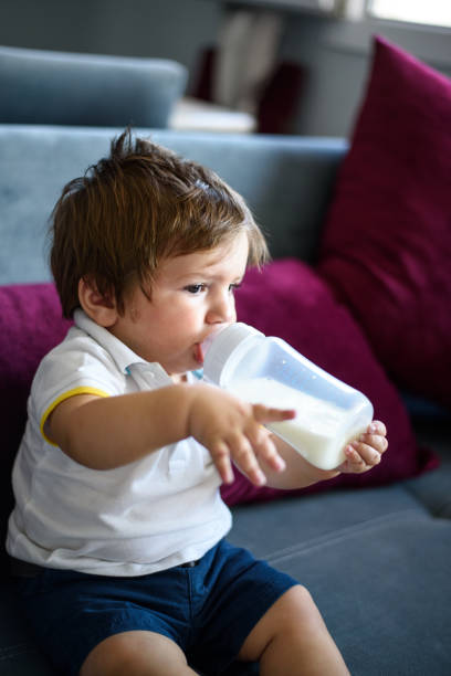 istock Baby boy drinking milk 851915394