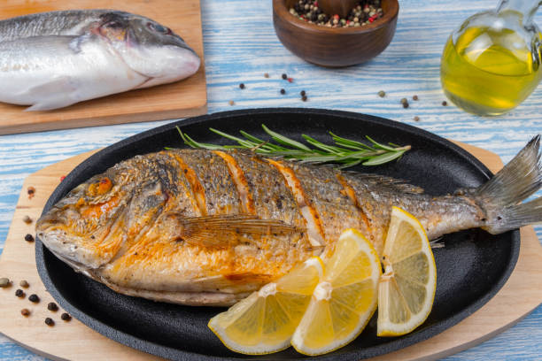 istock Grilled dorado in pan on wooden Background 851916142