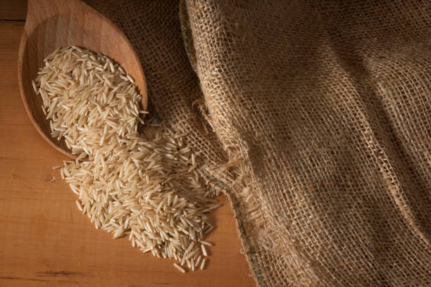 istock Basmati Rice Wooden Spoon Horizontal Overhead 851916360