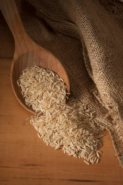 istock Basmati Rice Wooden Spoon Vertical Overhead 851916420