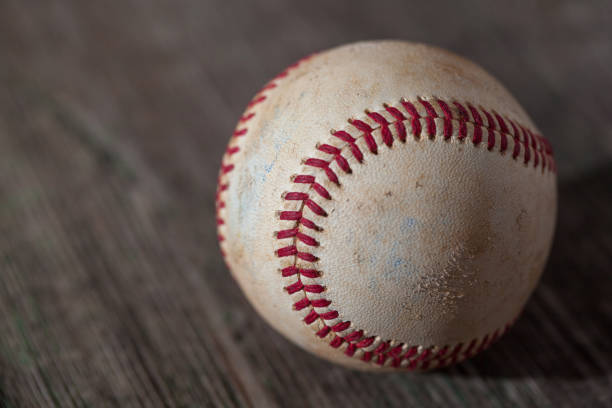 istock A baseball on an old wood table, sport 851917260