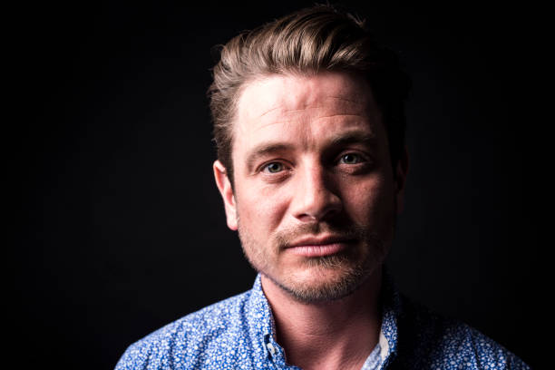 istock Closeup portrait of confident man on black background 851919978