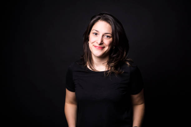 istock young caucasian woman portrait on black background 851920800