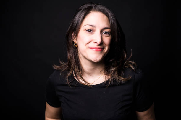 istock young caucasian woman portrait on black background 851921044