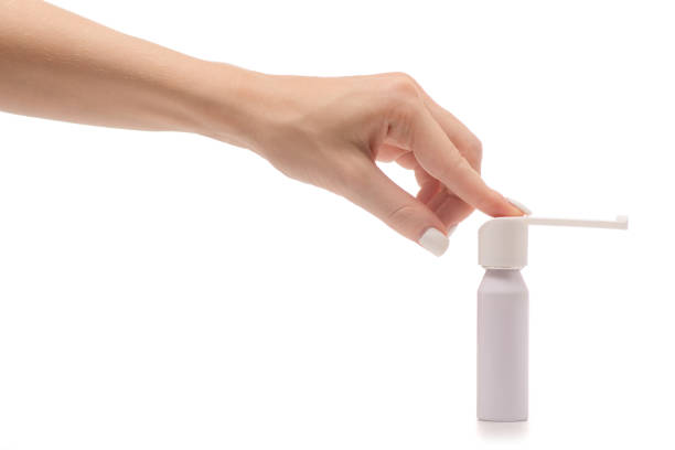 istock Female hand spray for throat 851921390