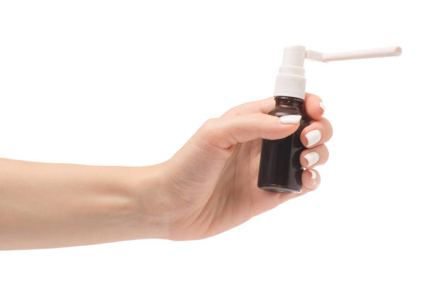 istock Female hand spray for throat 851921832