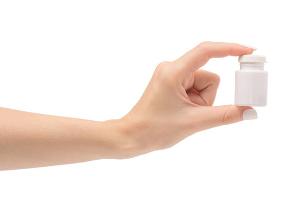 istock Female hands with a pot with pills 851921840