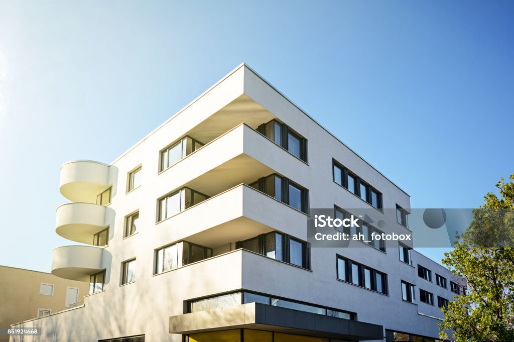 New residential and commercial building with modern facade in the city Building Exterior Stock Photo