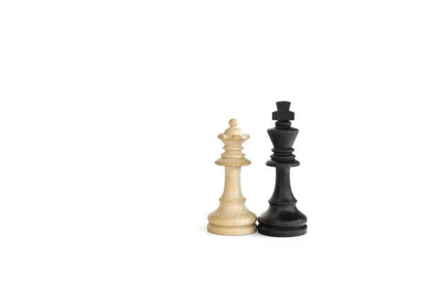 istock White queen and black king, traditionally confronted in chess game, are together. Image in isolated white background 851926944