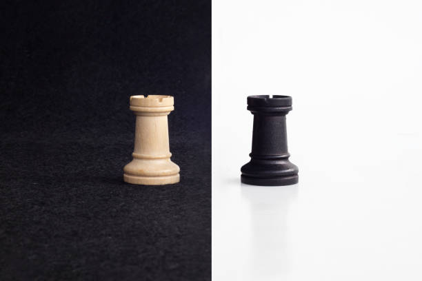 istock Pair of tower chess peaces confronted as opposites in black and white background 851926996
